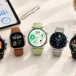 Overhead view of five smartwatches on a white desk with a tablet and globe, representing smart watch sourcing for global buyers